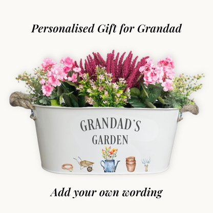 Decorative metal planter with flowers labeled 'Grandad's Garden' on a white background
