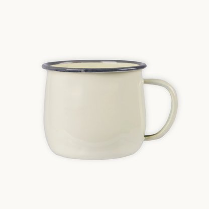 White mug with a black rim on a white background