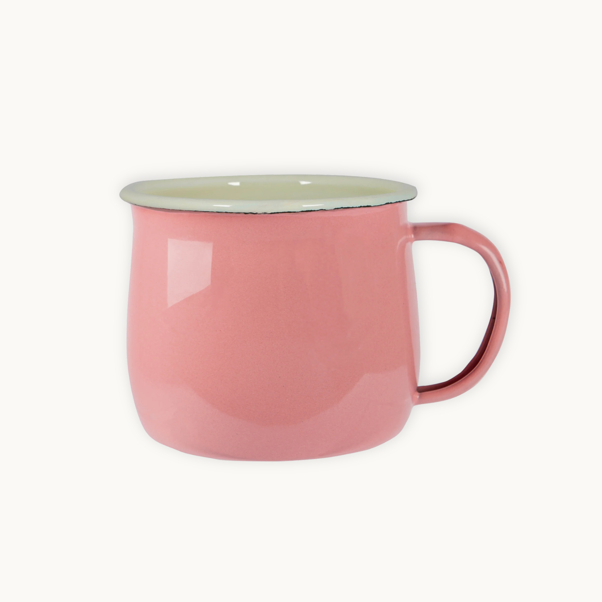 Pink mug with a light green interior on a white background
