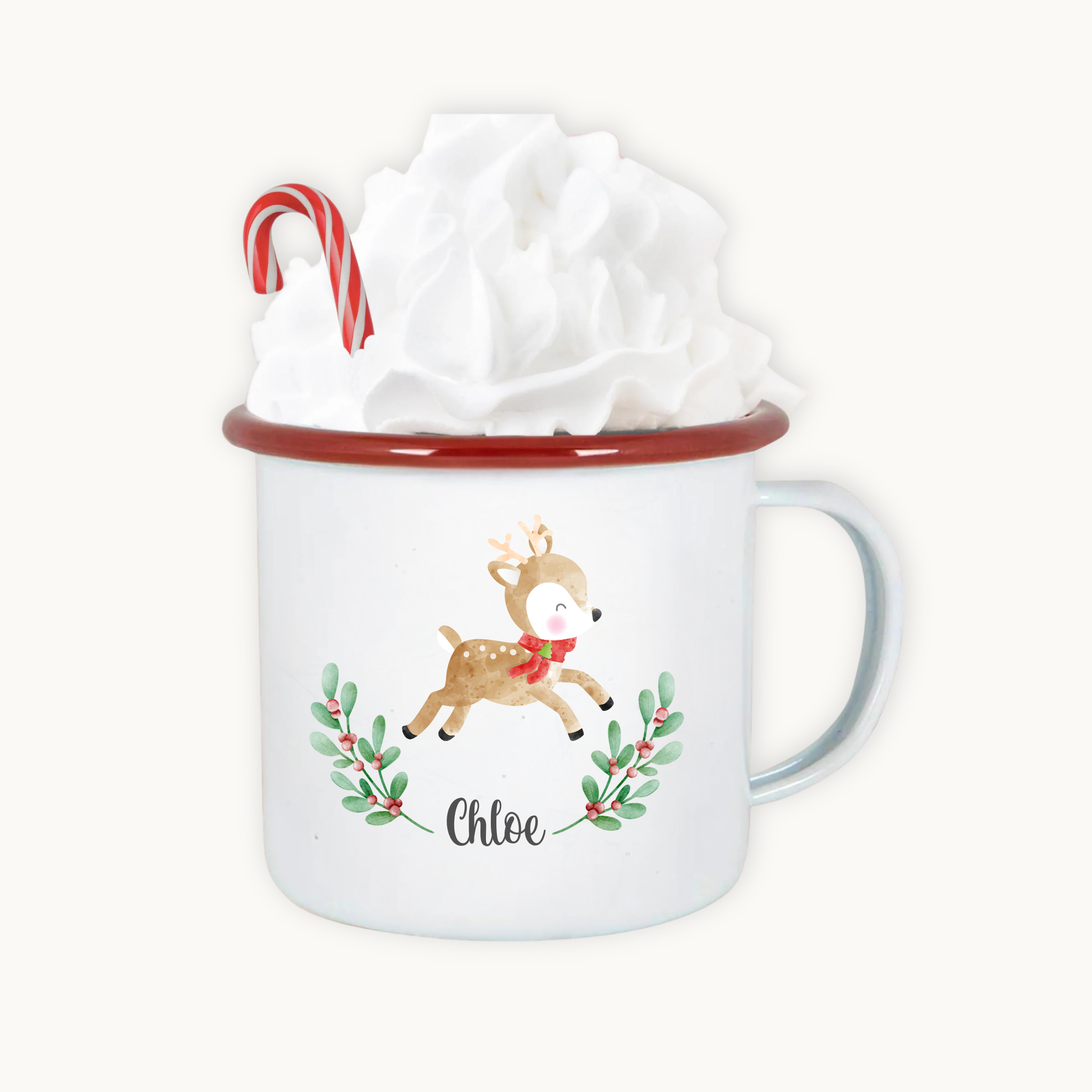 Mug with a reindeer design and candy cane, wrapped in tissue paper on a white background