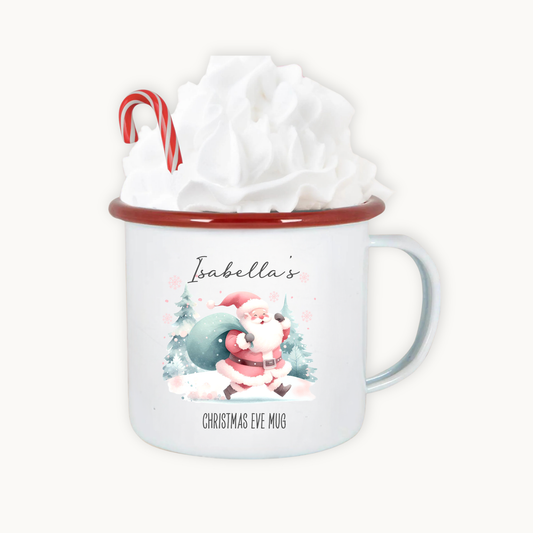 Christmas-themed mug with Santa Claus design and candy cane, wrapped in tissue paper.