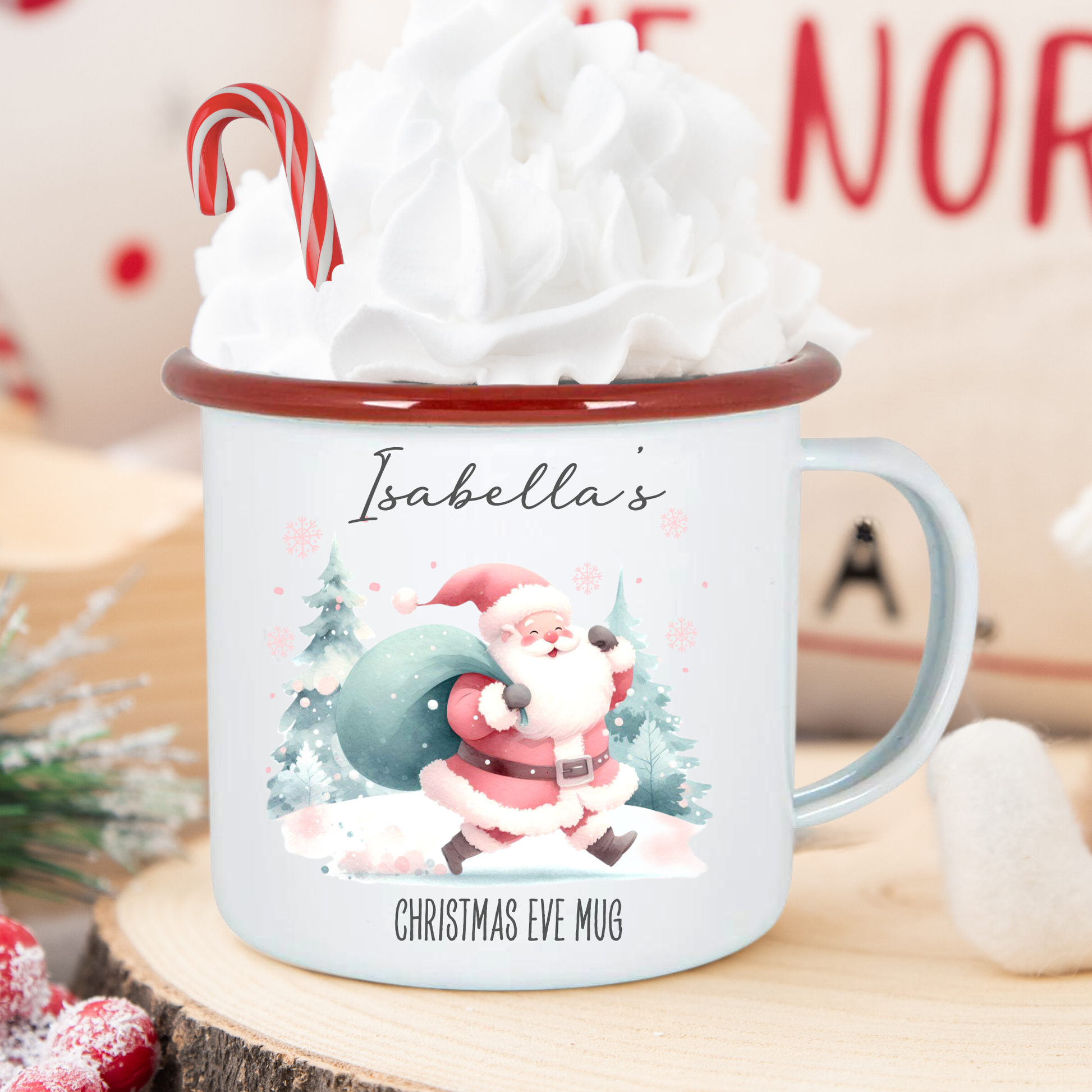 Personalized Christmas Eve mug with Santa Claus design, candy cane, and whipped cream on a wooden surface.