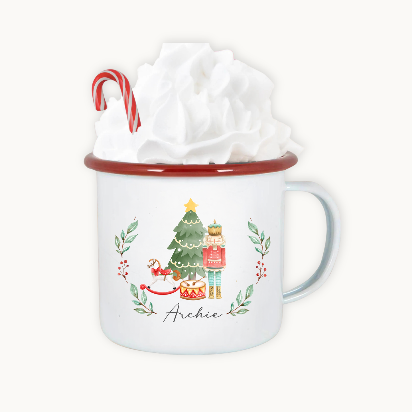 White mug with Christmas design and candy cane, wrapped in tissue paper on a white background