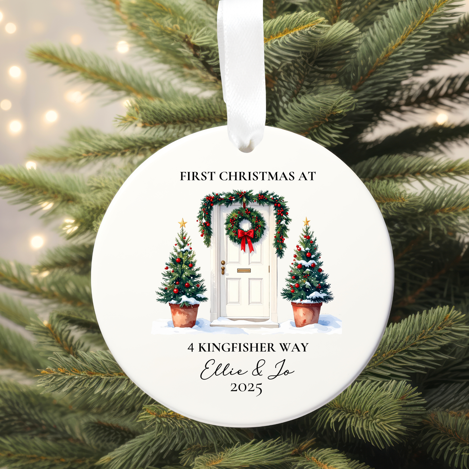 Personalized Christmas ornament with festive design on a tree.