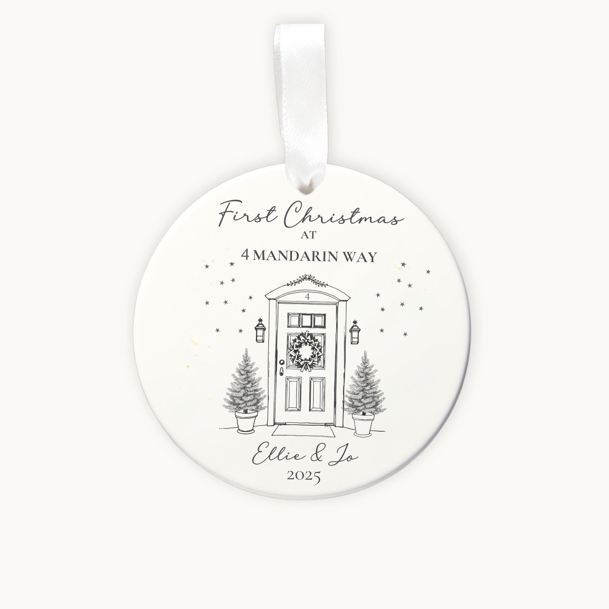 Round Christmas ornament with a door and tree design, featuring text 'First Christmas at 4 Mandarin Way' and 'Ellie & Jo 2025'.