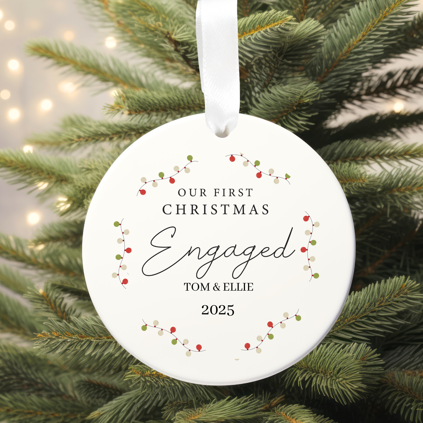 Round Christmas ornament with 'Our First Christmas Engaged' text on a tree.