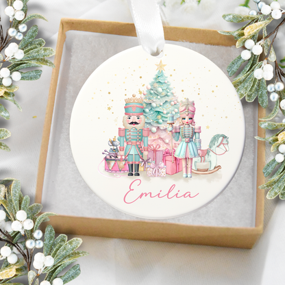 Decorative Christmas ornament with illustrations of Nutcrackers and a tree, framed by mistletoe.