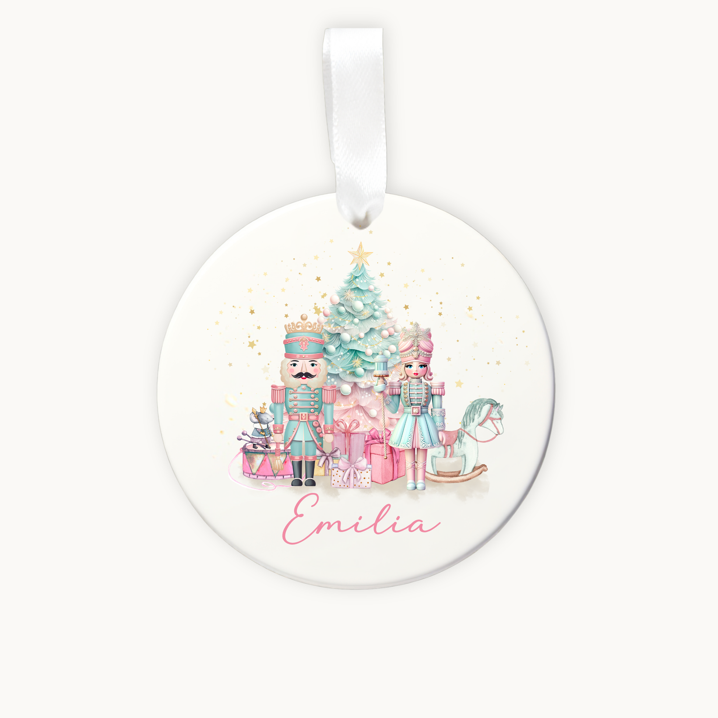 Round Christmas ornament with Nutcracker design and 'Emilia' text on a white background