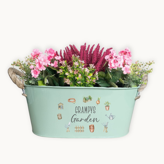 Mint green planter with flowers and 'Grampy's Garden' text on a white background