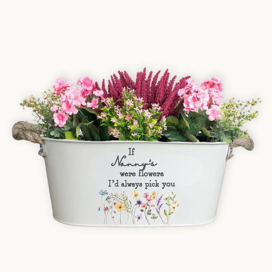 Decorative metal planter with flowers and 'If Nanny's were flowers I'd always pick you' text on a white background