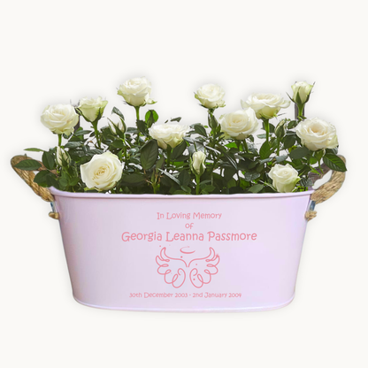 Floral arrangement in a pink container with text on a white background