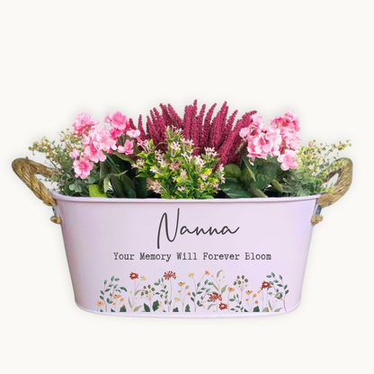 Decorative planter with flowers and 'Nanna Your Memory Will Forever Bloom' text on a white background