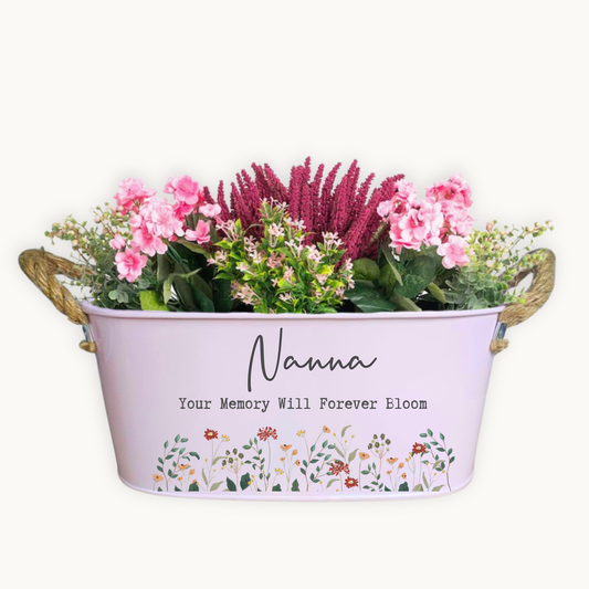 Decorative planter with flowers and 'Nanna Your Memory Will Forever Bloom' text on a white background