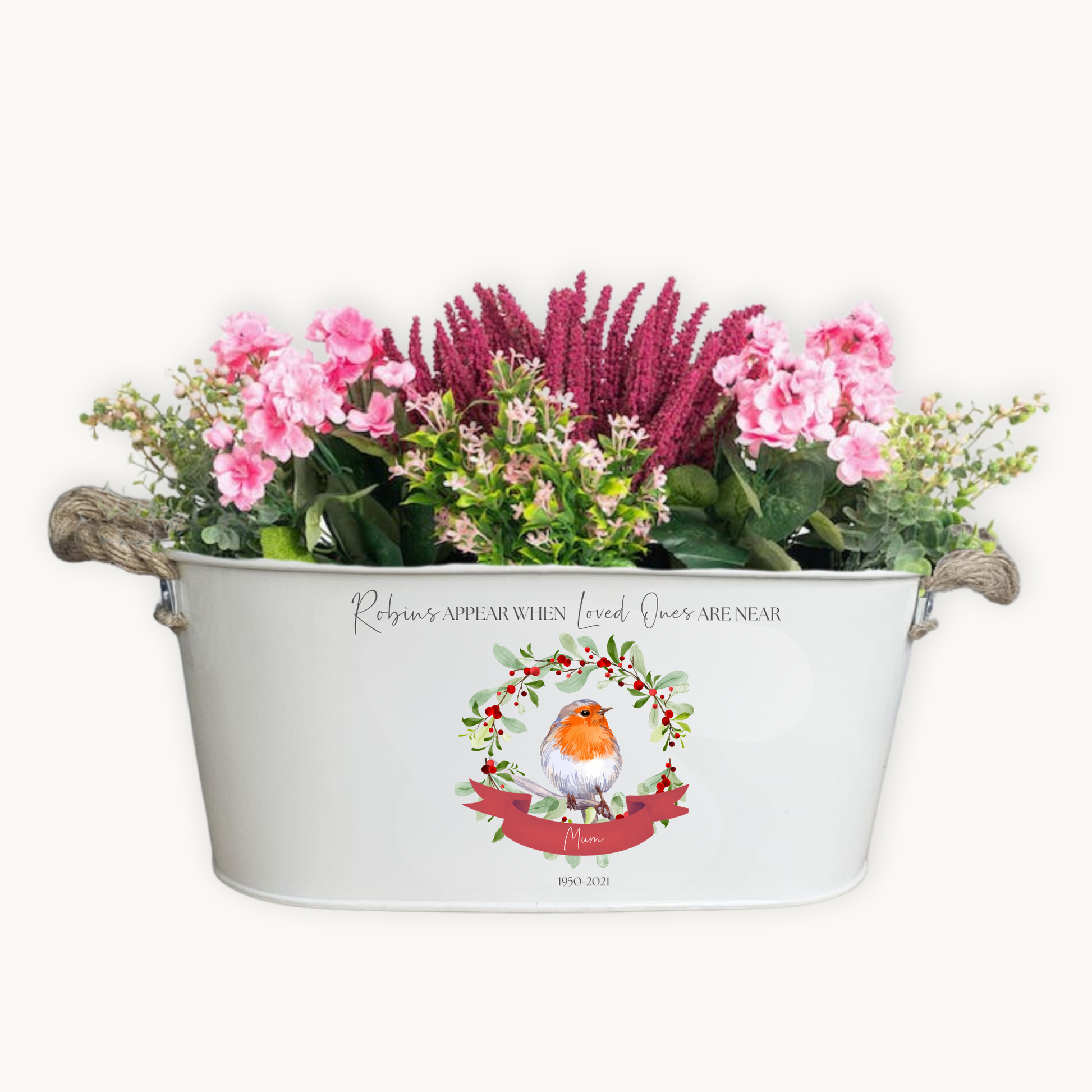 Decorative planter with flowers and a robin design on a white background