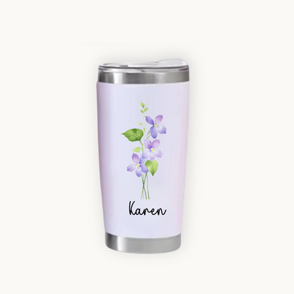 Tumbler with February birth flower floral design and name 'Karen' on a white background