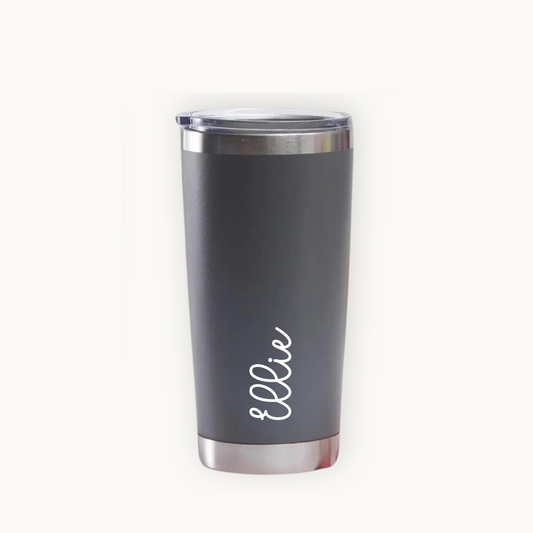 Gray tumbler with 'ellie' printed on a white background