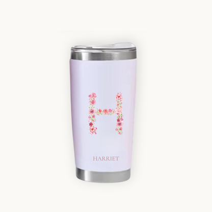 Pink tumbler with floral letter 'H' and name 'Harriet'