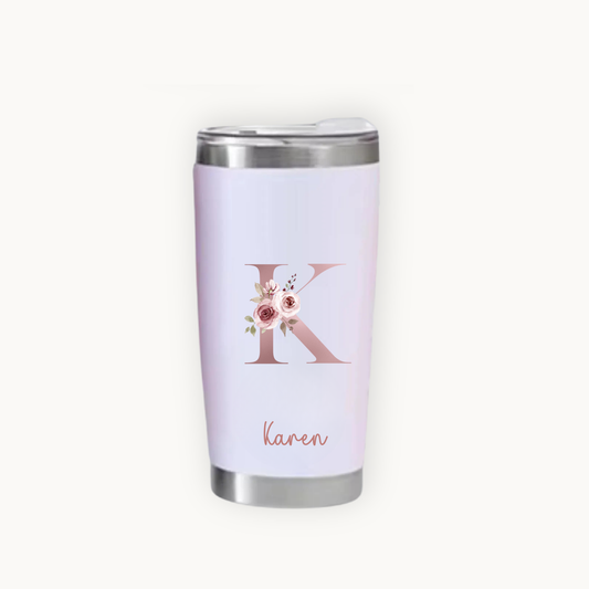Pink tumbler with floral design and 'Karen' text on a white background