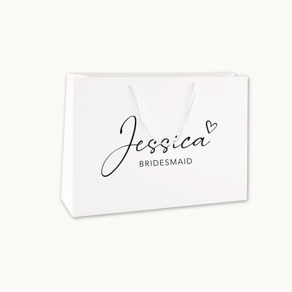 Luxury white gift bag with cotton rope handles printed with the words Jessica and Bridesmaid in script black font