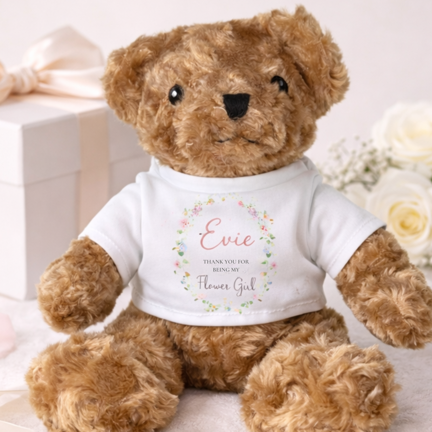 personalised brown teddy with printed t shirt saying evie thank you for being my flower girl with pretty floral element on t shirt