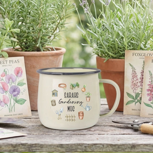 Gardening setup with potted plants, a mug, and seed packets on a wooden table.