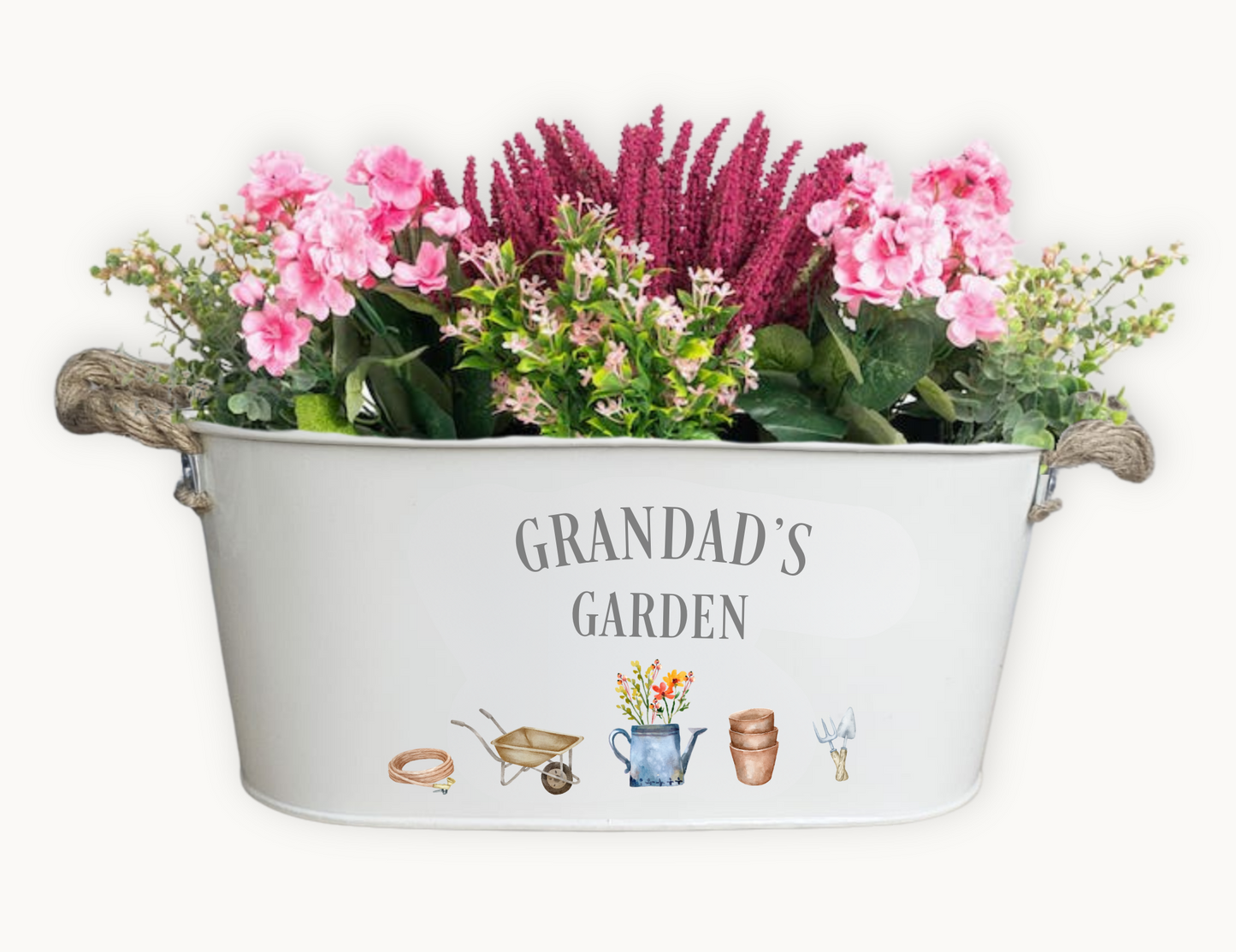 A personalised garden gift planter filled with pretty flowers, and printed with the words grandads garden with watercolour gardeing decals