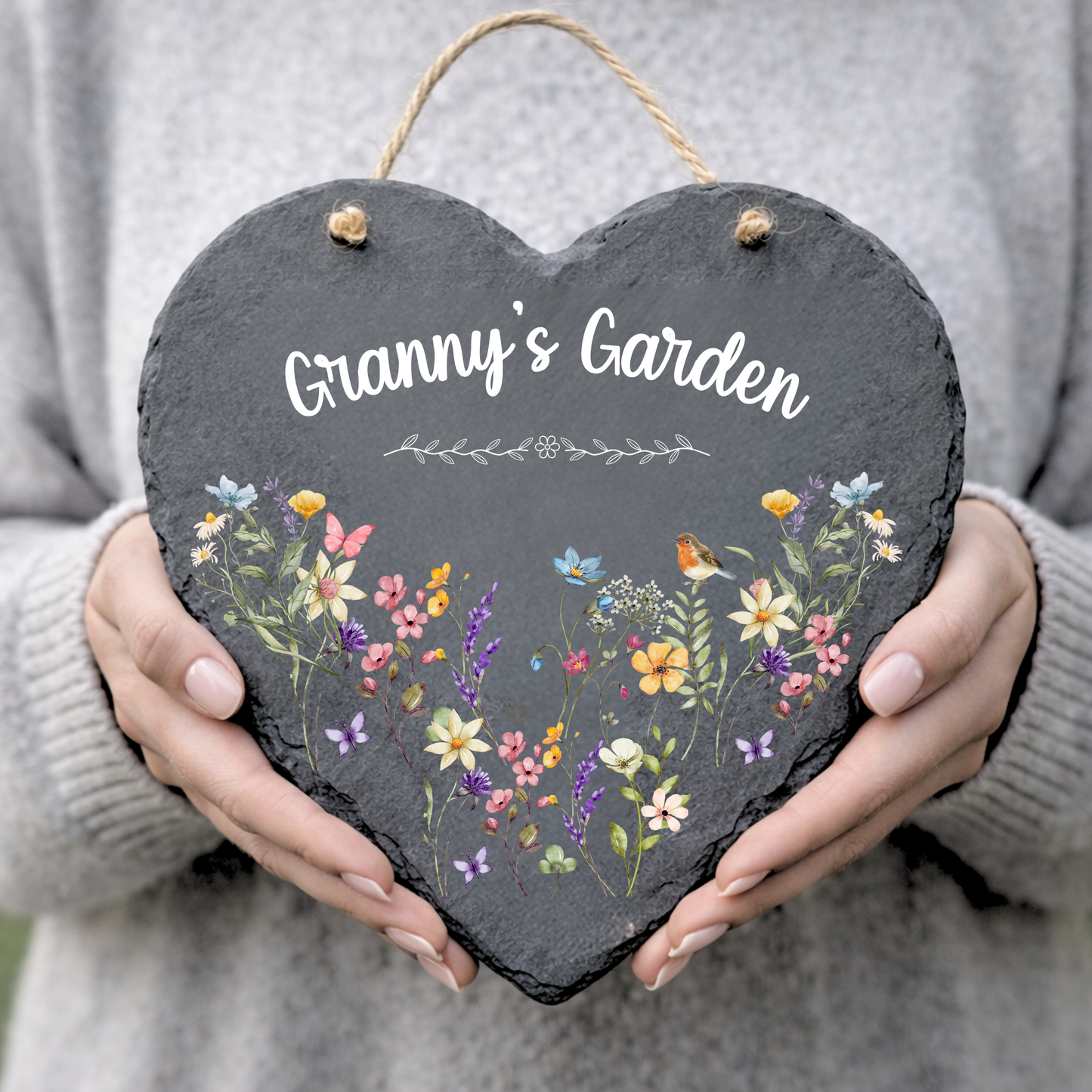 Personalised heart slate sign reading Granny’s Garden with wildflowers and robin, held in hands, garden plaque.