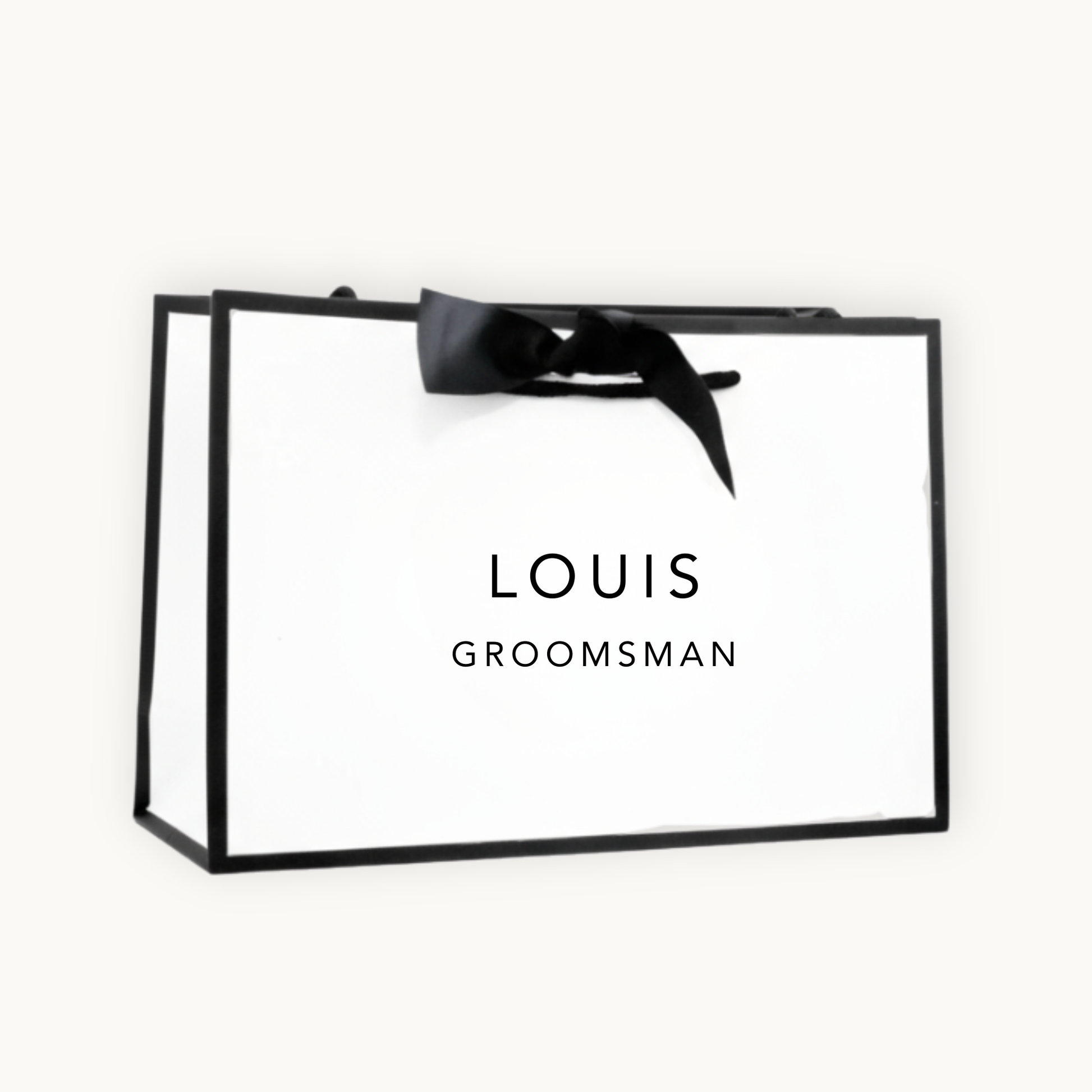 white gift bag with black border and black ribbon printed with the words Louis Groomsman