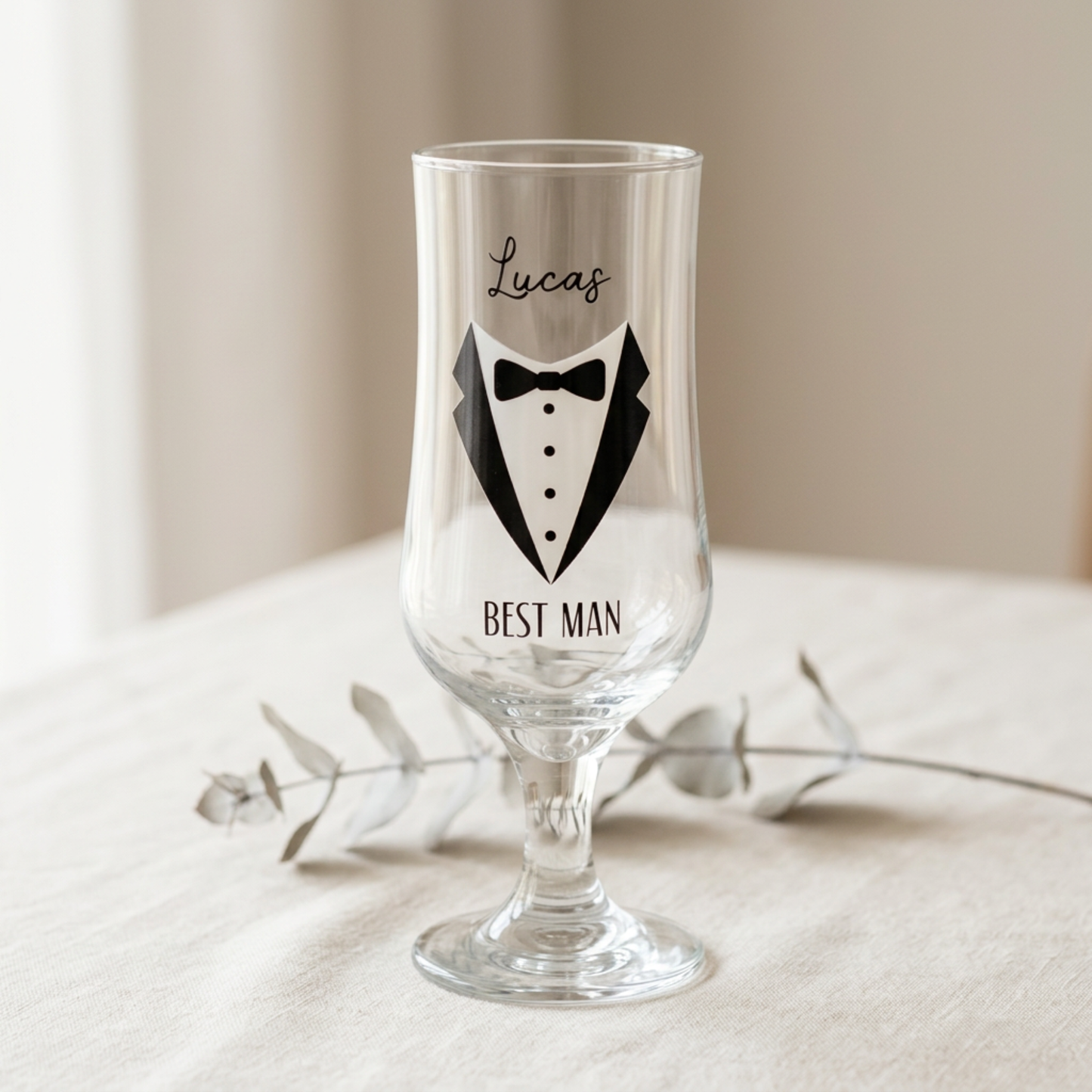 Clear glass with tuxedo design and 'Best Man' text on a neutral background