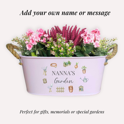 Decorative planter with flowers labeled 'NANNA'S Garden' on a white background