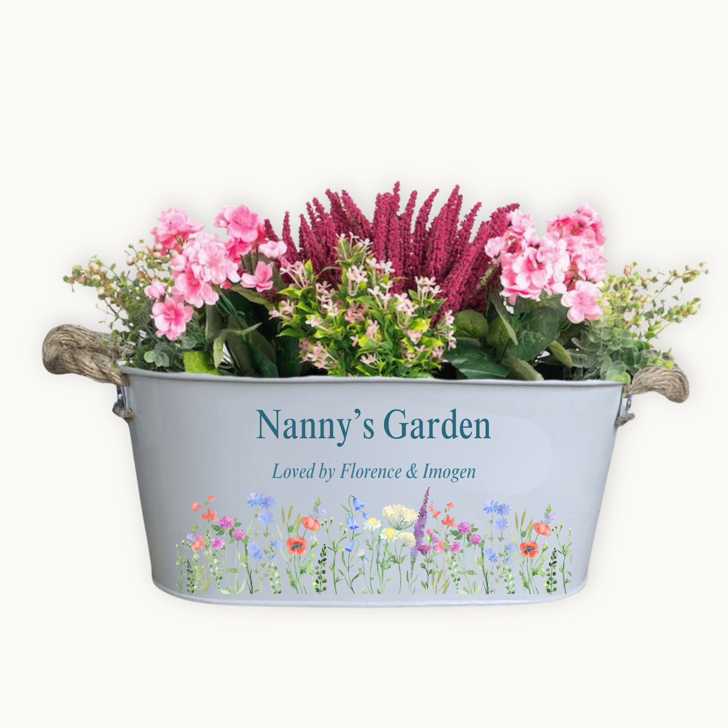 Decorative metal planter with flowers and 'Nanny's Garden' text on a white background